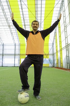 Male patient having fun on the sports field